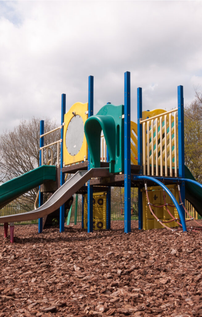Wood Chips vs Synthetic Turf Playground Surfacing Comparison
